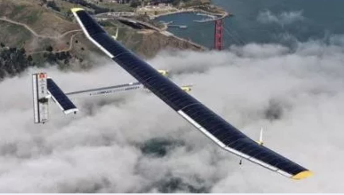 An aircraft flying above the clouds